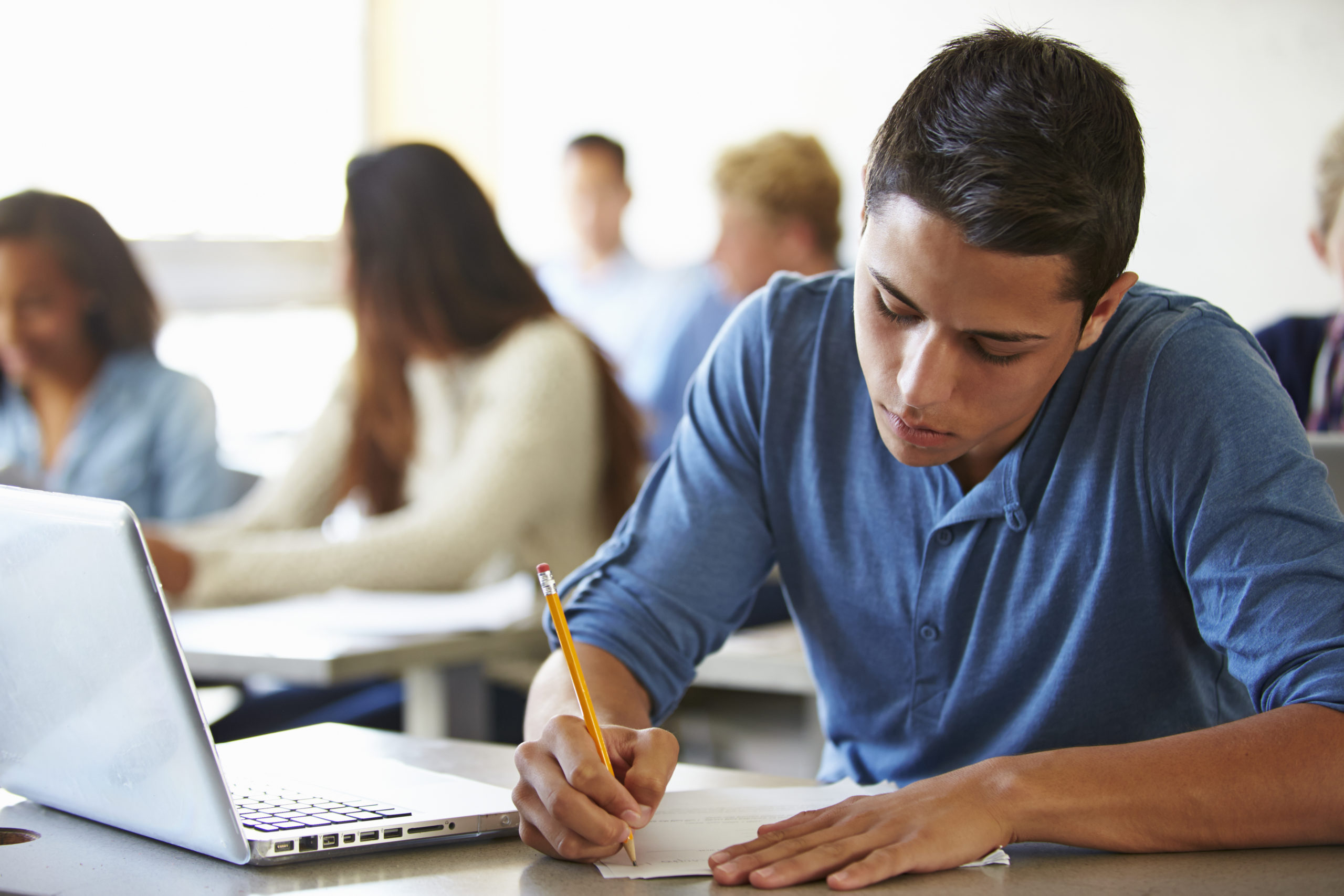 High School Students Studying For Test In Classroom